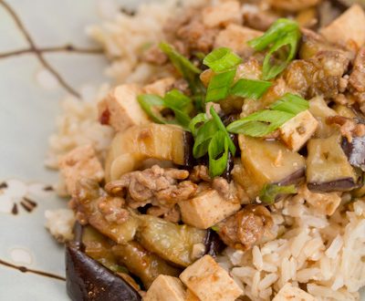 Eggplant, pork, and tofu stir-fry over rice.