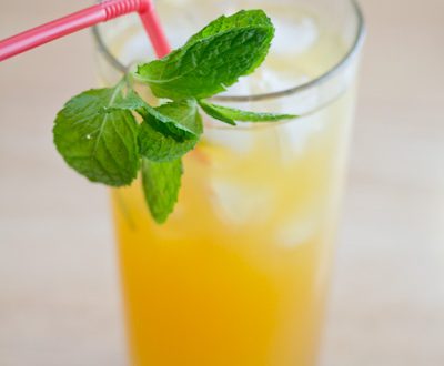 Apple julep in a glass with fresh mint.
