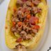 Spaghetti squash stuffed with turkey and tomato.