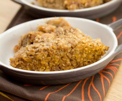 Baked pumpkin oatmeal in 2 oval dishes.
