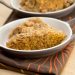 Baked pumpkin oatmeal in 2 oval dishes.