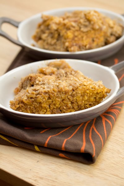 Baked pumpkin oatmeal in 2 oval dishes.