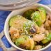 Brussels sprouts with white beans and Pecorino in a small bowl.