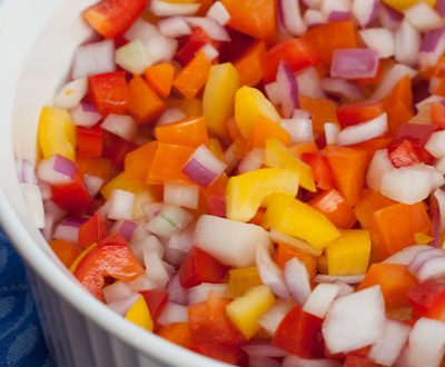 Bowl of colorful Brazilian bell pepper and onion vinaigrette.