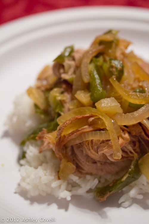 Teriyaki pork with onions and peppers over rice.