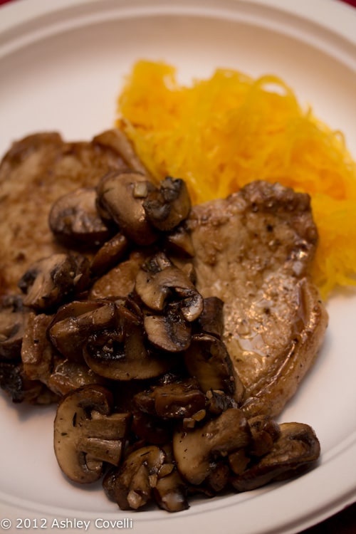 Pork chop with mushrooms and spaghetti squash.