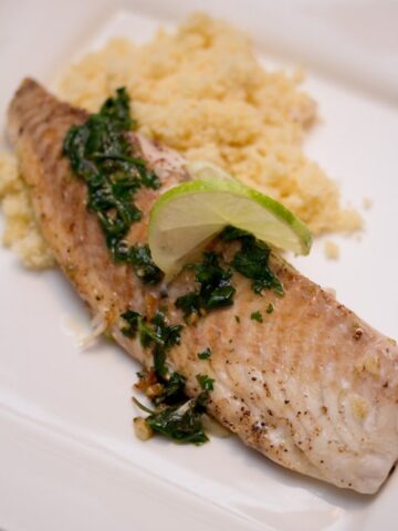 Tilapia with green sauce and couscous.