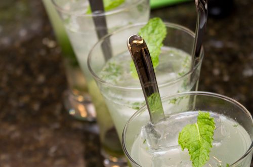 Glasses of mojitos garnished with fresh mint.