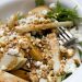 Arugula salad topped with pears and goat cheese.