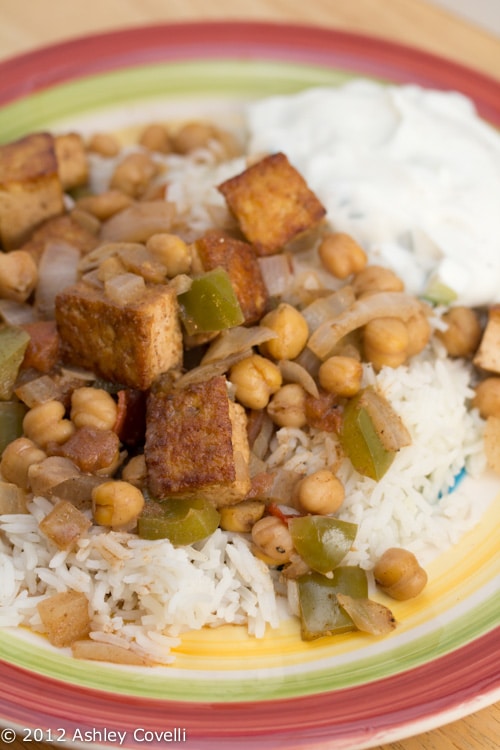 Plate of tofu masala with chickpeas over rice.