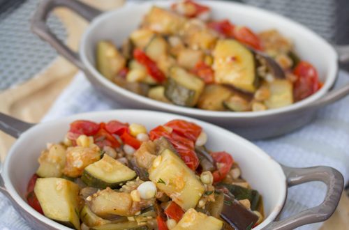 Sautéed veggies in two serving dishes.