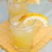 Two glasses of orange lemonade.