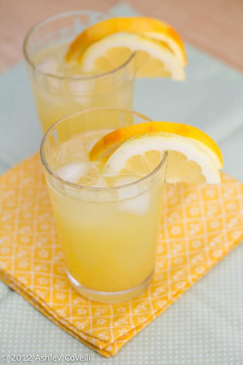 Two glasses of orange lemonade.