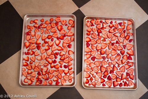 Strawberry slices on baking sheets.