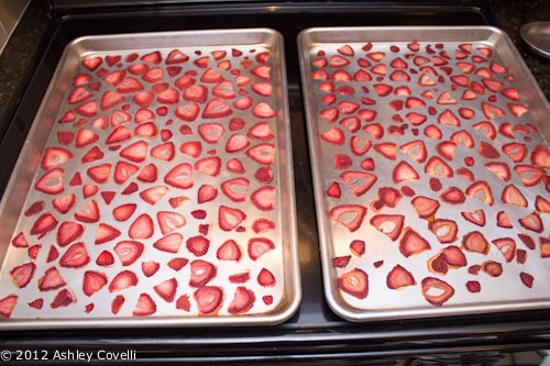 Strawberry slices on baking sheets.