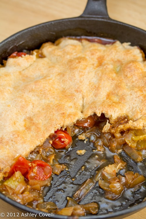 Overhead view of a partially eaten tomato tarte tatin.