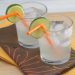 Moscow mules in glasses with orange straws and lime wheels.