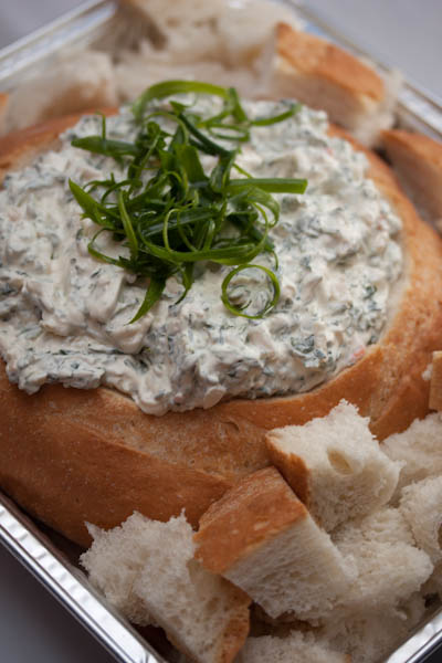 Spinach Dip served in a bread bowl.