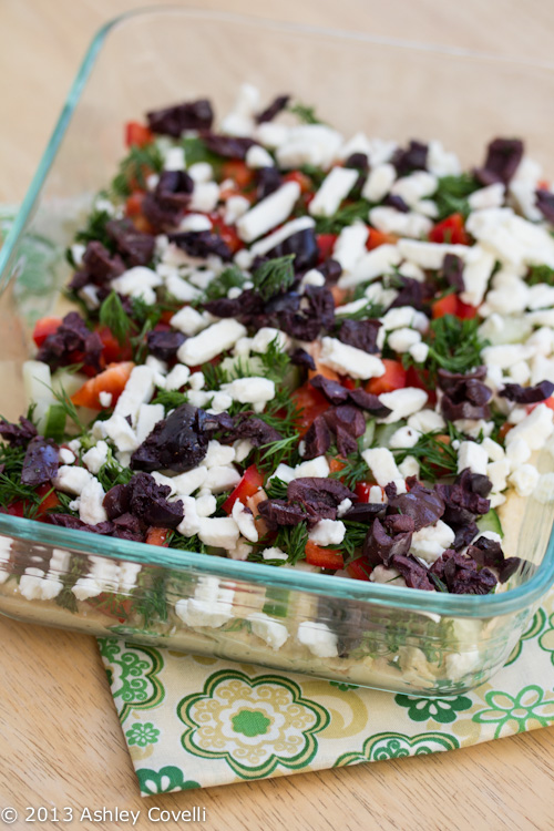 5 Layer Greek Dip in a serving dish.