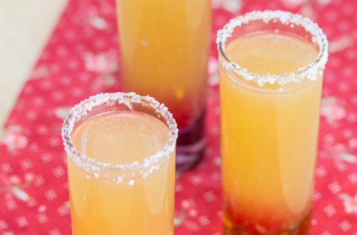 Three shot glasses with salted rims.