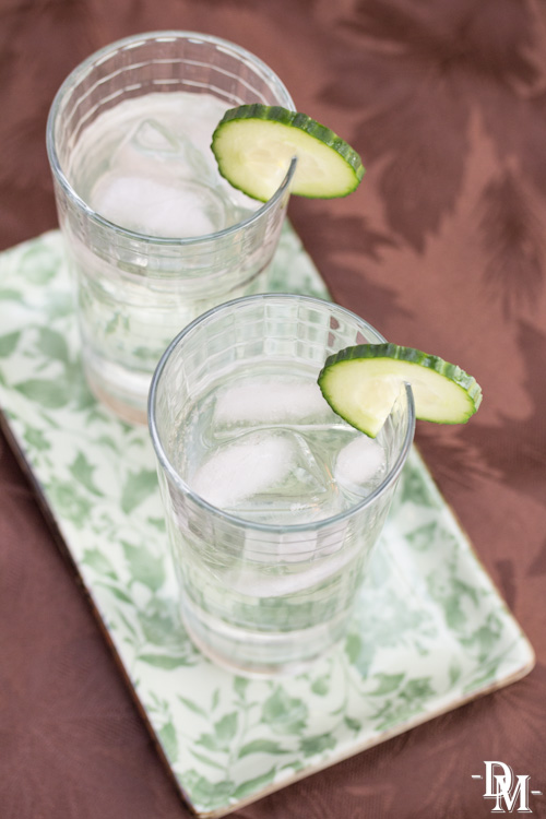 Gin cocktails garnished with lime.