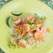 Overhead view of a plate of Apricot Soy Chili Shrimp with Quinoa.