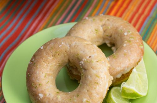 Margarita Donuts on a plate with lime wedges.