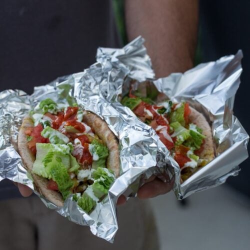 Pita sandwiches stuffed with NYC street cart-style chicken