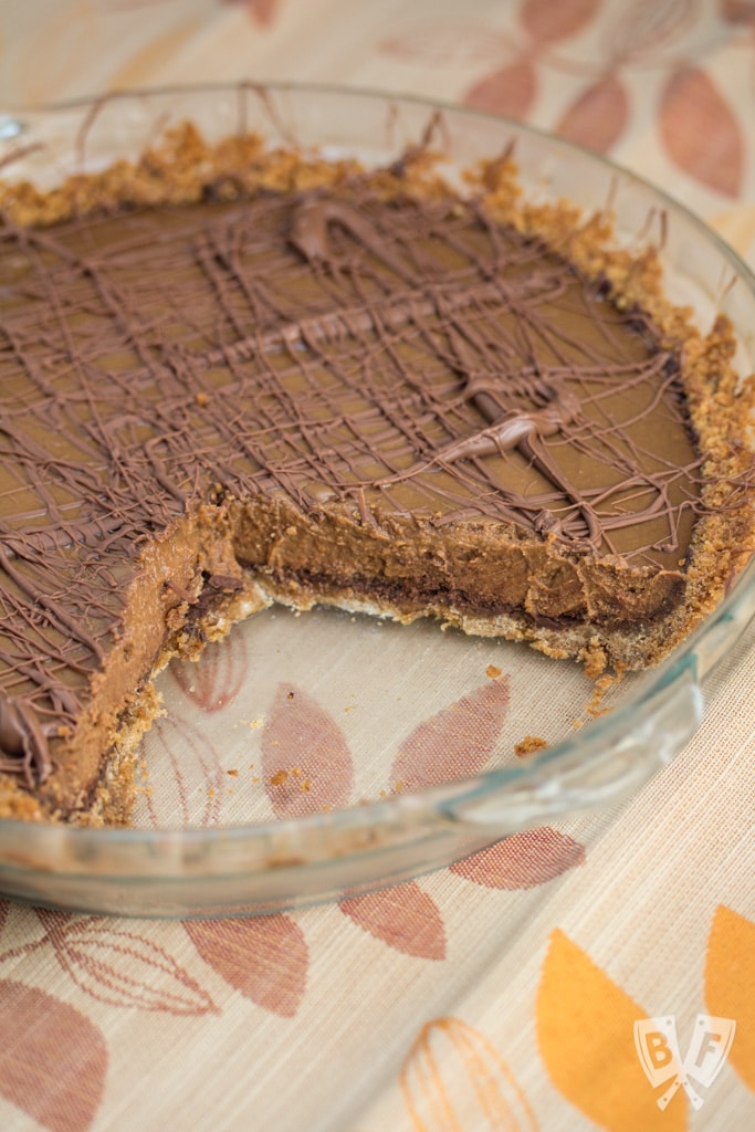 Triple-Chocolate Pumpkin Pie - Graham cracker crust is slathered with a layer of bittersweet chocolate that's hidden beneath a pumpkin & semi-sweet chocolate filling. Sure to be your new Thanksgiving holiday favorite!