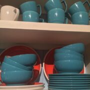 Cups, bowls, and plates on shelves.