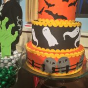 A papercraft Halloween cake sitting on top of a table.