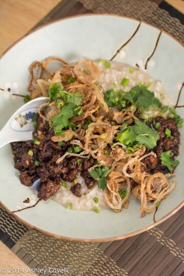 Congee & Caramelized Pork with Crispy Shallots and Black Garlic