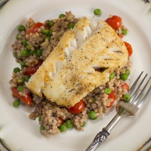 Pan-Fried Cod Over Garlicky Tomato & Pea Buckwheat Groats