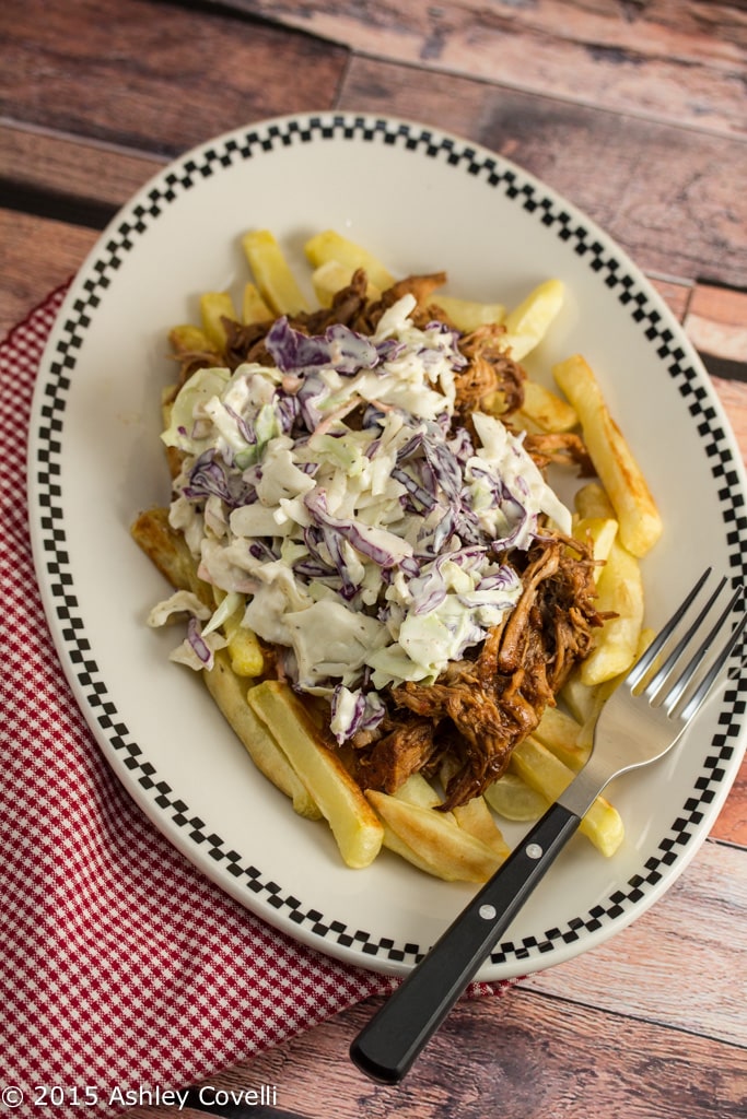 Bar-B-Q Pulled Pork Fries with Cole Slaw on a plate with a fork.