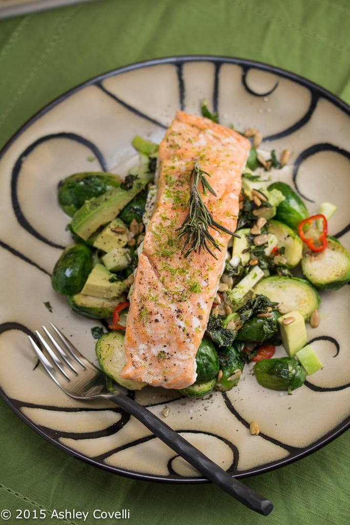 Plate of Slowly Cooked Salmon with Roasted Brussels Sprouts, Avocado & Apples.