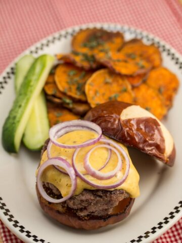 Short Rib Burgers on Pretzel Buns with Hoppy Cheddar Sauce & Roasted Sweet Potato Rounds