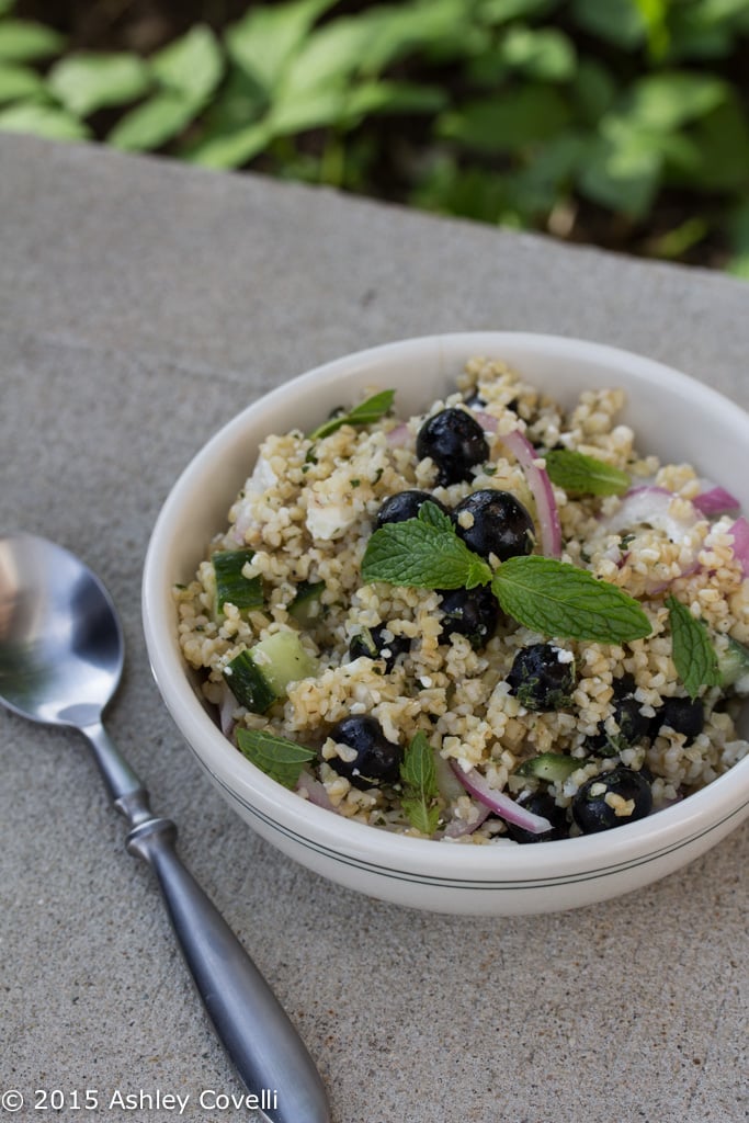 Blueberry and Feta Bulgur Salad with Mint Dressing with a spoon alongside.