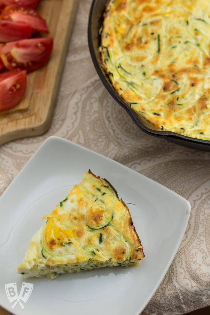 Zoodle Frittata - A drizzle of aged balsamic, grated Parmesan, garden fresh tomatoes and basil adorn this deliciously elegant yet simple breakfast dish.