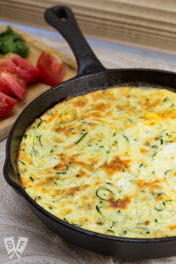 Zoodle Frittata - A drizzle of aged balsamic, grated Parmesan, garden fresh tomatoes and basil adorn this deliciously elegant yet simple breakfast dish.