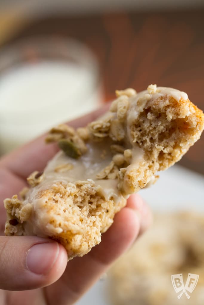 Baked Apple Spice Donuts with Maple Frosting and Pumpkin Granola (#ad): Crunchy granola is a perfect topping for these apple + Greek yogurt infused baked donuts. A great breakfast or dessert recipe to use your fall apple bounty! #StonyfieldBlogger