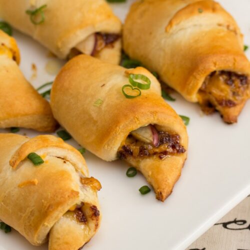Cheesy Bacon + Apple Croissants: Bacon jam adds smokiness to this sweet-and-salty 5 ingredient appetizer recipe. An easy apple-studded hors d'oeuvre that will be a hit at any fall party!