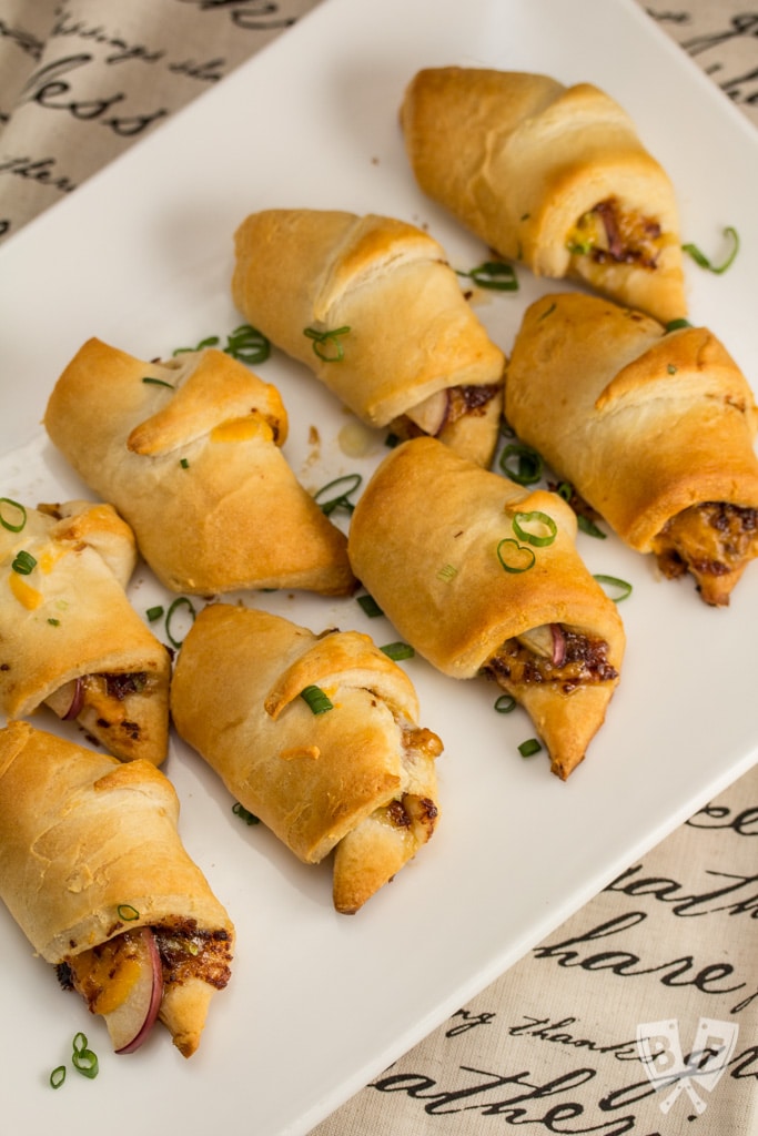 Cheesy Bacon + Apple Croissants: Bacon jam adds smokiness to this sweet-and-salty 5 ingredient appetizer recipe. An easy apple-studded hors d'oeuvre that will be a hit at any fall party!