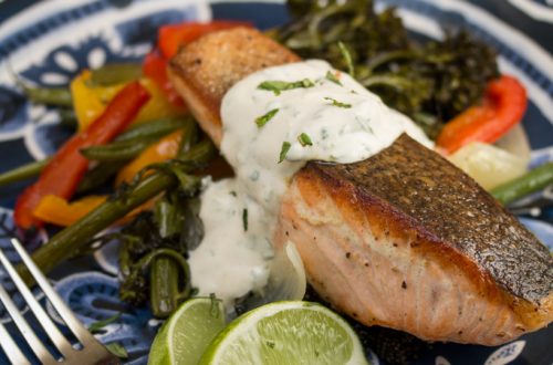 Crispy Skinned Salmon Over Roasted Veggies with Cilantro Mint Yogurt Sauce