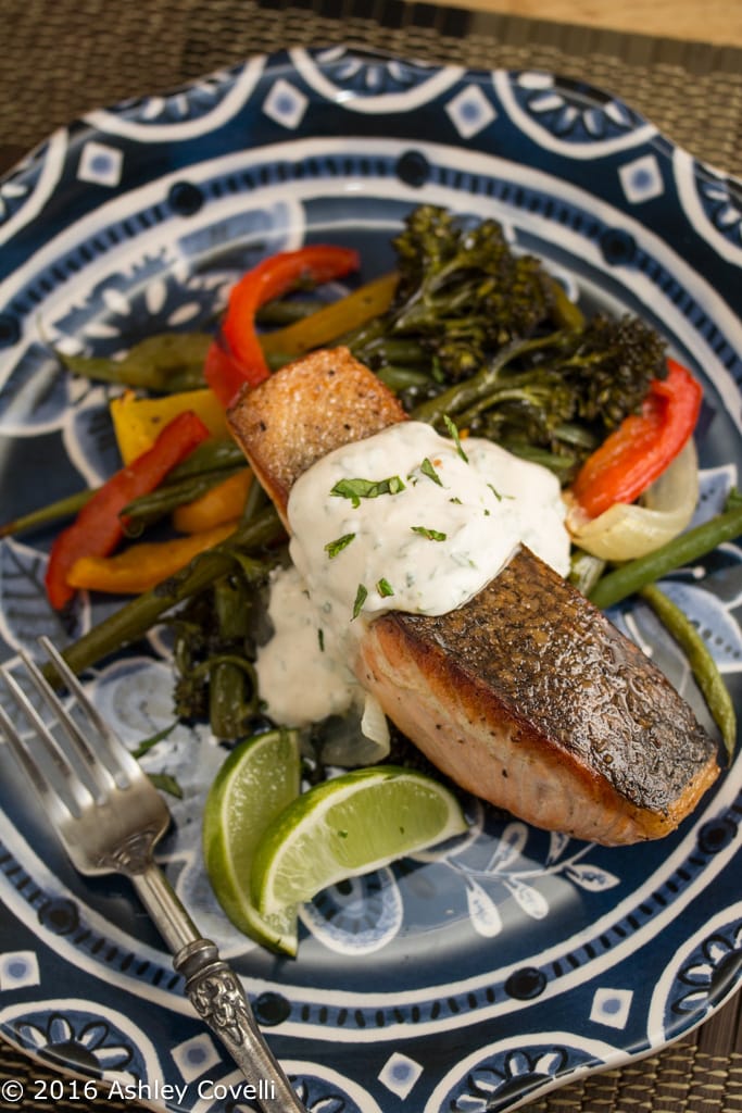 Crispy Skinned Salmon Over Roasted Veggies with Cilantro Mint Yogurt Sauce