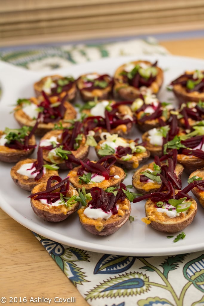 Platter of stuffed baby potato skin appetizers.