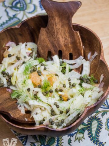 This fennel + citrus salad with shallots and capers is a deliciously crisp, fresh salad that satisfies all your sweet-and-salty cravings!