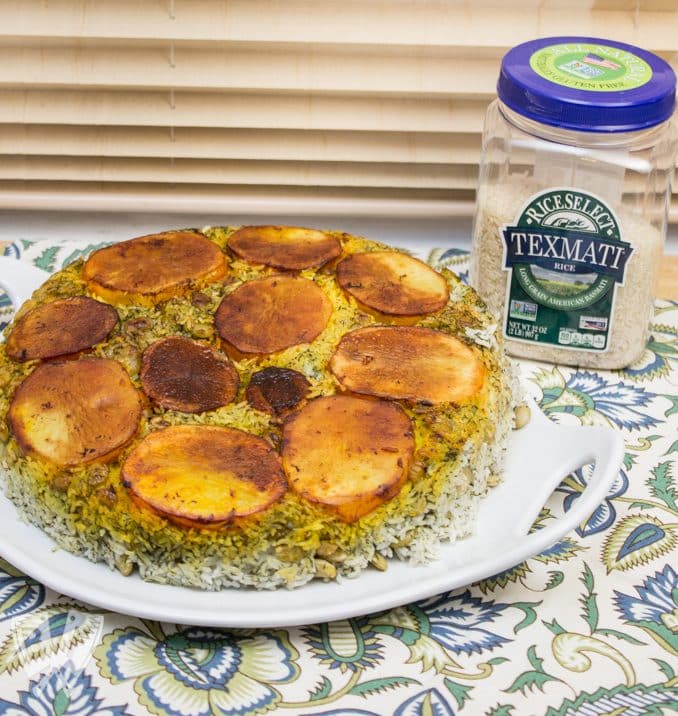 Polo Shevid Baghali (Persian Dill + Lima Bean Rice): Potatoes are fried in a buttery saffron mixture that help form a beautifully golden crust when this fragrant rice dish is turned out onto a platter. #ad