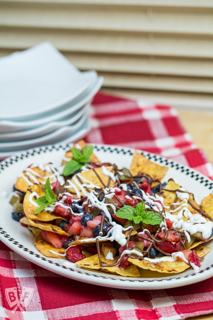 Dessert Nachos with Fresh Baked Cinnamon Tortilla Chips: A colorful fresh fruit salsa, honeyed Greek yogurt + chocolate hazelnut butter are piled atop this plate of sweet-and-salty nachos! #StonyfieldBlogger