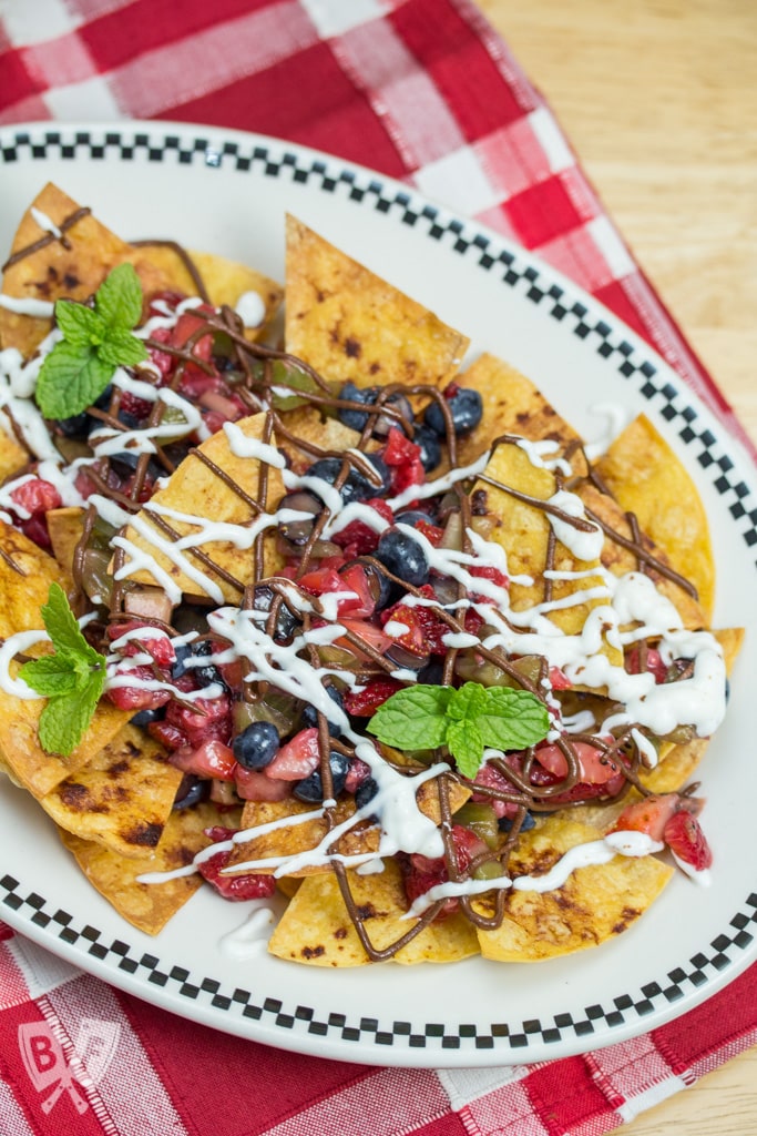 Dessert Nachos with Fresh Baked Cinnamon Tortilla Chips: A colorful fresh fruit salsa, honeyed Greek yogurt + chocolate hazelnut butter are piled atop this plate of sweet-and-salty nachos! #StonyfieldBlogger