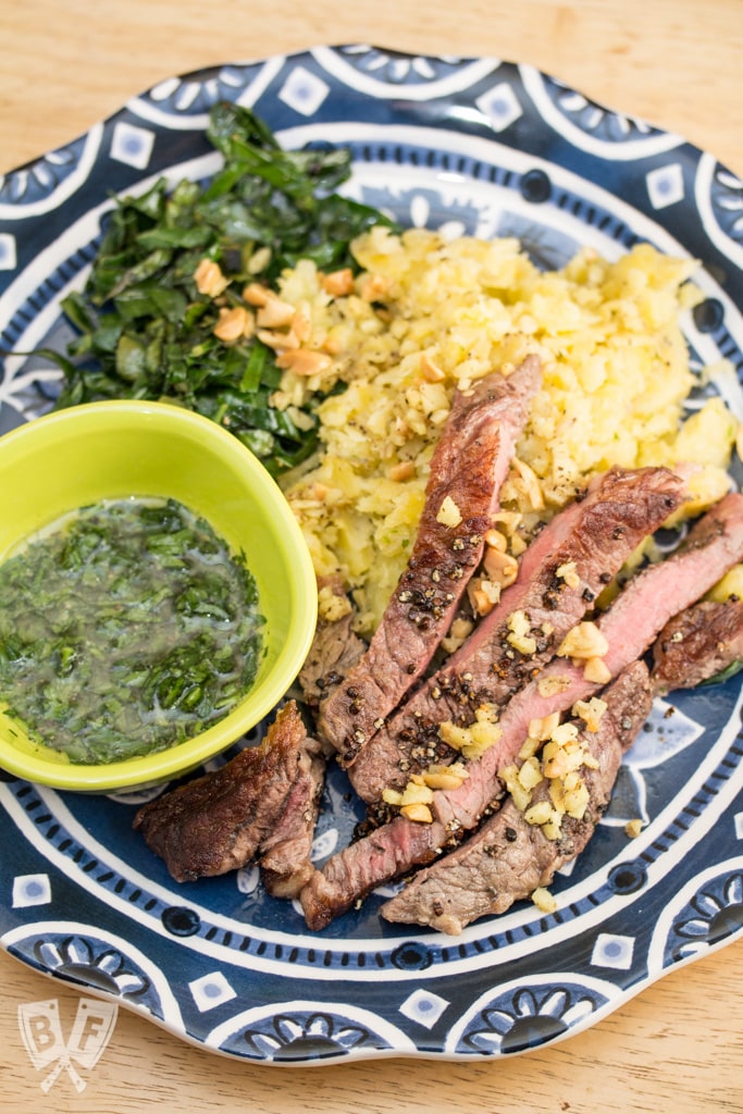 Grains of Paradise-Crusted Steaks with Mashed Plantain, Collard Greens & Ginger Peanuts: Switch up your meat and potatoes game with this West African-inspired meal.